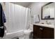 Bathroom with vanity, mirror, toilet, and shower with white shower curtain at 820 W University Dr # 4, Tempe, AZ 85281