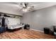 This bedroom has wood-look floors, a ceiling fan, and a closet with ample storage at 820 W University Dr # 4, Tempe, AZ 85281