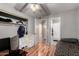 Bedroom with wood-look floors, light gray walls, ceiling fan, and ensuite bath at 820 W University Dr # 4, Tempe, AZ 85281