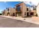 A charming brick and stucco townhome with single garage, and a small balcony off the upper level at 820 W University Dr # 4, Tempe, AZ 85281