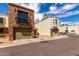 Attractive brick and stucco townhomes, each with a one car garage and desert landscaping at 820 W University Dr # 4, Tempe, AZ 85281