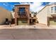 Brick and stucco townhome features a balcony, single garage and well-kept landscaping at 820 W University Dr # 4, Tempe, AZ 85281