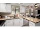 Galley-style kitchen featuring granite countertops, stainless steel appliances, and white cabinetry at 820 W University Dr # 4, Tempe, AZ 85281