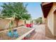 The backyard features a decorative gravel area, brick-paved patio, and mature shade tree at 873 W Sterling Pl, Chandler, AZ 85225