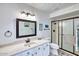 Bright bathroom features a walk-in shower, decorative ceiling, and updated vanity with ample storage at 873 W Sterling Pl, Chandler, AZ 85225