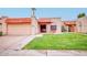 Charming single-story home boasts a well-maintained lawn, colorful bench, and inviting curb appeal at 873 W Sterling Pl, Chandler, AZ 85225