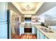 Well-lit kitchen with stainless steel appliances, granite countertops, and light blue cabinetry at 873 W Sterling Pl, Chandler, AZ 85225