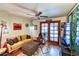 Cozy living room with a comfortable sofa, a ceiling fan, and unique decor at 873 W Sterling Pl, Chandler, AZ 85225