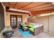 Relaxing covered patio with comfortable wicker furniture, a ceiling fan, and shade awning at 873 W Sterling Pl, Chandler, AZ 85225