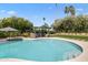 Inviting backyard pool with clear blue water, lush landscaping, and a covered seating area for outdoor enjoyment at 8814 N 86Th St, Scottsdale, AZ 85258