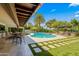 Stunning backyard pool area featuring a covered patio, pool, and outdoor seating for relaxing and entertaining at 8814 N 86Th St, Scottsdale, AZ 85258