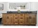 Bathroom vanity with double sinks, wood cabinets, and a large mirror at 8814 N 86Th St, Scottsdale, AZ 85258