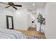 Bright bedroom with wood floors, and a view to the hall and stairway at 8814 N 86Th St, Scottsdale, AZ 85258