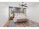 Comfortable bedroom with natural light, a ceiling fan, and a gray accent wall at 8814 N 86Th St, Scottsdale, AZ 85258