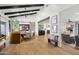 Open concept dining area with wooden beams, built-in seating and seamless flow to kitchen and living areas at 8814 N 86Th St, Scottsdale, AZ 85258