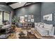 Cozy office with dark walls, a desk, a sofa, and eclectic art at 8814 N 86Th St, Scottsdale, AZ 85258
