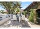 Charming outdoor patio featuring ample seating, mature trees, and a heater for comfortable outdoor living at 8814 N 86Th St, Scottsdale, AZ 85258