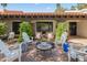 Inviting patio area featuring cozy seating, a fire pit, and a covered space with decorative accents at 8814 N 86Th St, Scottsdale, AZ 85258