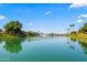 Scenic pond with a fountain and waterfront homes, creating a picturesque and tranquil setting at 8814 N 86Th St, Scottsdale, AZ 85258