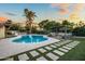 Inviting pool with an outdoor living area, including a dining set and lounging area at 8814 N 86Th St, Scottsdale, AZ 85258