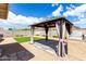 Beautiful backyard featuring a gazebo, artificial grass and gravel at 900 E Saratoga St, Gilbert, AZ 85296
