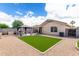 Expansive backyard with a gazebo and artificial grass. Perfect for entertaining and relaxation at 900 E Saratoga St, Gilbert, AZ 85296