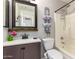 Cozy bathroom featuring vanity with decorative mirror and a shower-tub combo at 900 E Saratoga St, Gilbert, AZ 85296