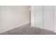 Bedroom featuring carpet, closet with sliding doors and an interior door at 900 E Saratoga St, Gilbert, AZ 85296