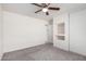 Bedroom featuring carpet, ceiling fan and recessed storage space at 900 E Saratoga St, Gilbert, AZ 85296