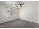 Bedroom featuring carpet, ceiling fan and a window with natural light at 900 E Saratoga St, Gilbert, AZ 85296