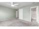 A Primary bedroom including fresh paint, flooring, a closet, and ceiling fan at 900 E Saratoga St, Gilbert, AZ 85296