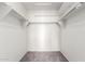 Walk-in closet with shelves and rod for ample storage at 900 E Saratoga St, Gilbert, AZ 85296