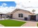 Exterior showcases the home's stucco finish, tiled roof, and well-maintained yard with desert landscaping at 900 E Saratoga St, Gilbert, AZ 85296