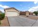 A single-Gathering home with a well-maintained yard and an attached two-car garage at 900 E Saratoga St, Gilbert, AZ 85296