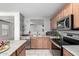 Kitchen featuring stainless steel appliances, countertops, and a window view to other rooms at 900 E Saratoga St, Gilbert, AZ 85296