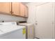 Bright laundry room with cabinets and modern washer and dryer at 900 E Saratoga St, Gilbert, AZ 85296
