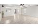 Open-concept living room featuring neutral paint, tile floors, and ceiling fan at 900 E Saratoga St, Gilbert, AZ 85296