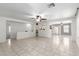 Open-concept living room featuring neutral paint, tile floors, and a ceiling fan at 900 E Saratoga St, Gilbert, AZ 85296