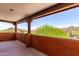Inviting balcony featuring desert views, wood beams, and stucco, perfect for relaxing and taking in the scenery at 9137 E Odessa St, Mesa, AZ 85207