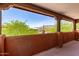 Inviting balcony featuring desert views, wood beams, and stucco, perfect for relaxing and taking in the scenery at 9137 E Odessa St, Mesa, AZ 85207