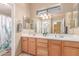 Bathroom with double sinks and an orchid decoration at 9137 E Odessa St, Mesa, AZ 85207