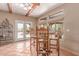 Charming dining area with bar stool seating, open windows, and terra cotta tile floors at 9137 E Odessa St, Mesa, AZ 85207