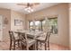Dining room featuring rustic table set, natural light, and terra cotta tile flooring at 9137 E Odessa St, Mesa, AZ 85207