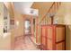 Welcoming foyer with tiled floors, a decorative front door, and staircase at 9137 E Odessa St, Mesa, AZ 85207