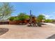 Inviting two-story home with desert landscaping, mature trees, and mountain views at 9137 E Odessa St, Mesa, AZ 85207