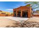 Exterior view of a three car garage and extra parking with a spiral staircase on the side at 9137 E Odessa St, Mesa, AZ 85207