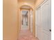Hallway view featuring archway, tiled floor and access to other rooms at 9137 E Odessa St, Mesa, AZ 85207