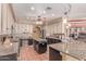Spacious kitchen with granite countertops, kitchen island, and tiled floor at 9137 E Odessa St, Mesa, AZ 85207