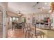 Bright kitchen with granite countertops, stainless appliances, bar seating, and dining area at 9137 E Odessa St, Mesa, AZ 85207
