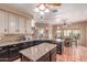 A bright eat-in kitchen with granite countertops, tiled floors, and stainless steel appliances at 9137 E Odessa St, Mesa, AZ 85207